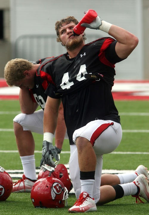 Steve Griffin  |  The Salt Lake Tribune

University of Utah's Dave Kruger drinks some water during football practice at Rice Eccles Stadium on the university campus in Salt Lake City on Friday, Aug. 19, 2011.