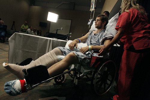 Scott Sommerdorf  |  The Salt Lake Tribune             
Brandon Wright is wheeled away from a press conference he held at IMC in Salt Lake City on Thursday. He thanked the people he called heroes that lifted a car off of him, and probably saved his life after a car versus motorcycle crash.