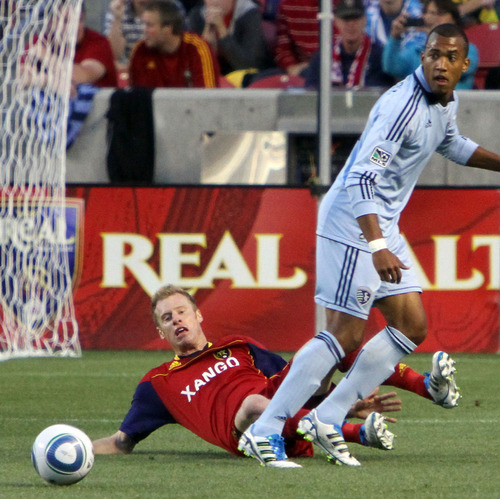 Real Salt Lake defender Nat Borchers looses the ball to Kansas City forward Teal Bunbury in the first half in Rio Tinto Stadium.
Stephen Holt/ Special to the Tribune