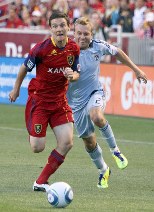 Real Salt Lake midfielder Will Johnson makes a break for it past Sporting Kansas City defender Michael Harrington in the first half at Rio Tinto Stadium.
Stephen Holt/ Special to the Tribune