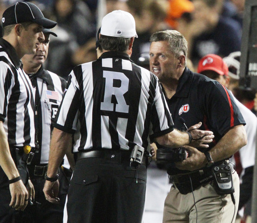 Rick Egan | The Salt Lake Tribune

Utah head coach Kyle Whittingham argues a call with the referees during Utah's game against BYU at Lavell Edwards Stadium in Provo, Utah September 17, 2011.