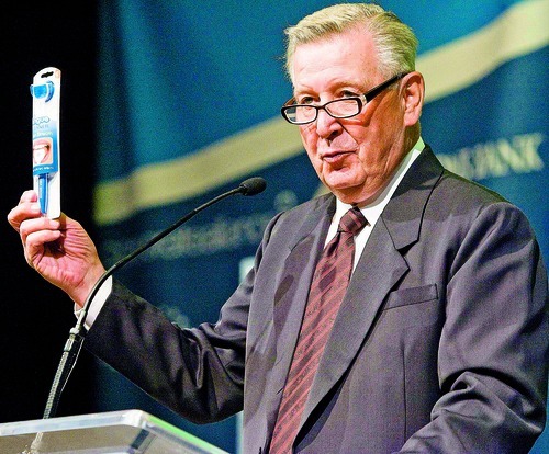 Tribune file photo
Robert Wagstaff, the founder of the company OraBrush, holds up his product, the OraBrush, which is now on sale in Walmart.