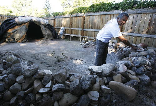 Francisco Kjolseth  |  The Salt Lake Tribune
Stephen Todachiny, a traditional American Indian healer, looks recently through the many rocks that have been brought to him that he uses every two weeks within a buffalo-style sweat lodge at the Indian Walk In Center in Salt Lake City.