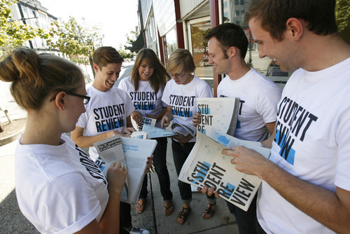 Francisco Kjolseth  |  The Salt Lake Tribune
Opening up a new stack of the freshly printed Student Review, BYU students Mackenzie Mayo, Nick Smith, Sarah Smith, Tamarra Kemsley, Hunter Schwarz and Craig Mangum, from left, joke around about their new endeavor of resurrecting the Student Review, an unsanctioned publication that thrived on campus in the 1980s and 1990s, then died in 1997. Monday they released their first monthly edition as the core members gathered at Muse Music Cafe in Provo, 151 N. University, one of the paper's main sponsoring businesses.