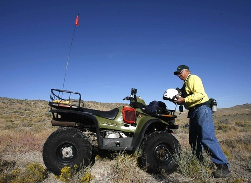 Rick Egan  | The Salt Lake Tribune 

Jim Porter, of Richfield, prepares to search the Topaz Mountain area, early Monday morning, September 19, 2011.