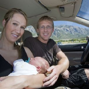 Al Hartmann  |  The Salt Lake Tribune
Ashley and Ben Marsden with their newborn son after coming home from the hospital on Tuesday. Ashley gave birth along the side of Interstate 15 in Ogden in their Volkswagen Jetta on Sept. 19 as they were racing to the hospital. Ben delivered the healthy boy they named Hawk Benjamin Marsden. He is the couple's fourth child.