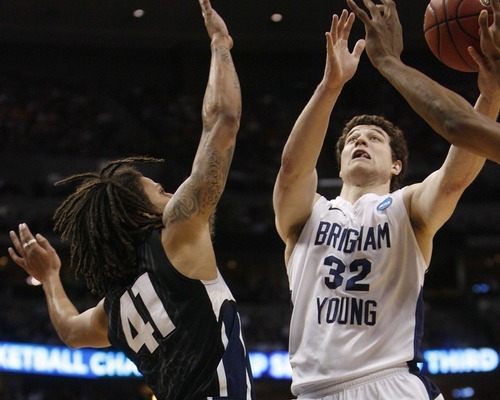 Trent Nelson  |  The Salt Lake Tribune
BYU's Jimmer Fredette shoots over Gonzaga's Steven Gray as BYU defeats Gonzaga in the NCAA Tournament, men's college basketball at the Pepsi Center in Denver, Colorado, Saturday, March 19, 2011, earning a trip to the Sweet 16.