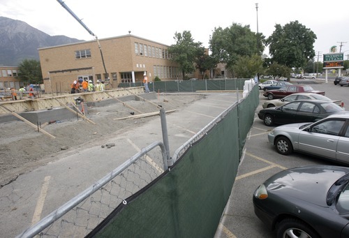 Rick Egan  | The Salt Lake Tribune 

Construction of the new Olympus high school has taken up most of the parking on the North end of the old building,  Friday, September 16, 2011. Olympus High is being rebuilt on the site of the old school while students are in the old building