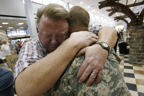 Francisco Kjolseth  |  The Salt Lake Tribune
Proud father Jeff Coates embraces his son Roy Coates of Sandy as he exclaims, 
