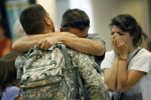 Francisco Kjolseth  |  The Salt Lake Tribune
Zach Delgado of Ogden is greeted by an emotional father, Raymond Delgado and his sister Monique, 16, after returning from a one-year-term of duty in Afghanistan. The first wave of approximately 40 soldiers from the 971st Medical Logistics Company (Army Reserve) in Ogden returned on Wednesday, Sept. 21, 2011, at Salt Lake City International Airport. The 971st Medical Company's one-year mission was mostly the shipping and receiving of medical supplies.