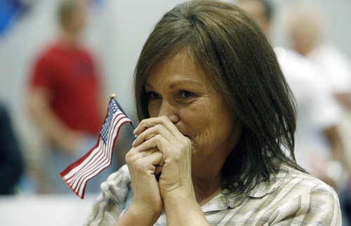 Francisco Kjolseth  |  The Salt Lake Tribune
Darla Brennan of Layton has trouble containing her excitement to see her son Monan Brennan for the first time in a year as the first wave of approximately 40 soldiers from the 971st Medical Logistics Company (Army Reserve) in Ogden returns from deployment to Afghanistan on Wednesday, Sept. 21, 2011, at Salt Lake City International Airport. The 971st Medical Company's one-year mission was mostly the shipping and receiving of medical supplies.