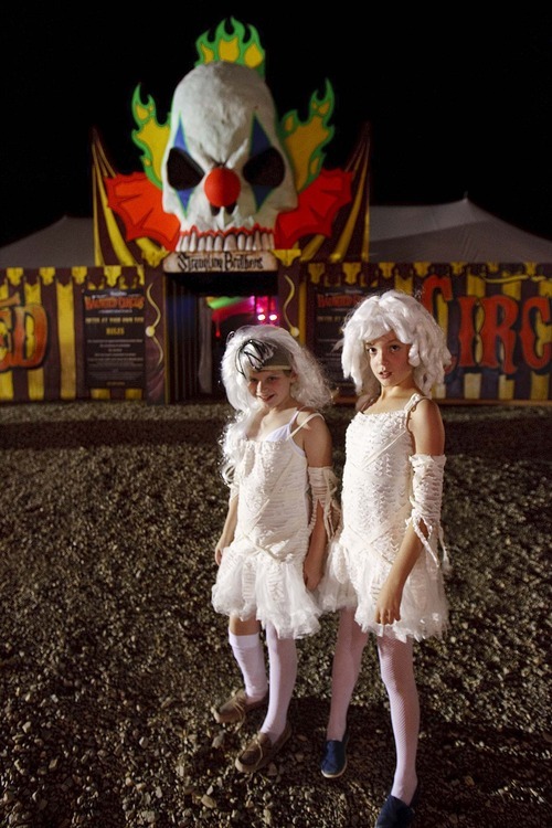 Trent Nelson  |  The Salt Lake Tribune
Bella Thornton and Elle Wilbern are two tightrope walkers who had an accident at the Strangling Brothers Haunted Circus in Draper on Friday. Strangling Brothers has 23 custom designed tractor-trailers, each with a different experience and innovative lighting and sound environments.