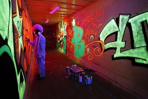 Trent Nelson  |  The Salt Lake Tribune
A demented graffiti artist at work at the Strangling Brothers Haunted Circus in Draper, Utah, Friday, September 16, 2011. Strangling Brothers has 23 custom designed tractor-trailers, each with a different experience and innovative lighting and sound environments.