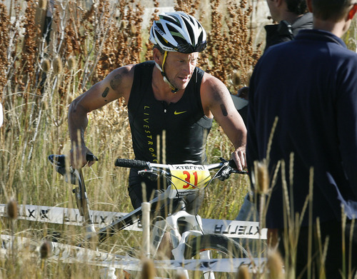 Scott Sommerdorf  |  The Salt Lake Tribune             
Lance Armstrong transitions from swimming to the bicycle leg of the 2011 XTERRA Nationals held at Snowbasin, Saturday, September 24, 2011. Armstrong finished fifth with a time of 2:29.25.