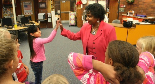 Paul Fraughton  |  The Salt Lake Tribune 
Joyce Gray gives third-grader Karla Vargas a high-five after speaking at Horizon Elementary School in Murray on Friday. Gray is one of hundreds of African-American 