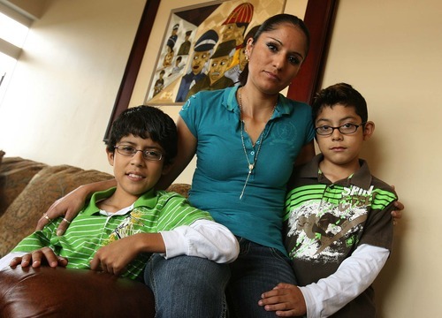 Leah Hogsten  |  The Salt Lake Tribune
Silvia Alfaro and her two sons Leonel Medina, 11, left, and Guadalupe Medina, 9, at their West Valley home Aug. 18. In 2009, Silvia Alfaro's husband, Leonel Medina, was deported to Mexico. His lawyer, James H. Alcala, has been accused of defrauding undocumented immigrants and conspiracy against the United States. Alcala is now a fugitive.