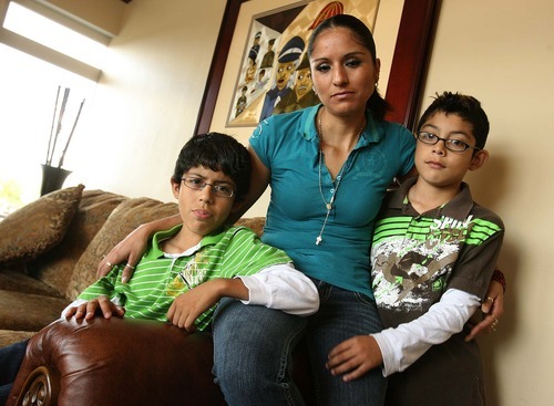 Leah Hogsten  |  The Salt Lake Tribune
Silvia Alfaro and her two sons Leonel Median, 11, left, and Guadalupe Medina, 9, at their West Valley home Aug. 18. In 2009, Silvia Alfaro's husband, Leonel Medina, was deported to Mexico. His lawyer, James H. Alcala, has been accused of defrauding undocumented immigrants and conspiracy against the United States. Alcala is now a fugitive.