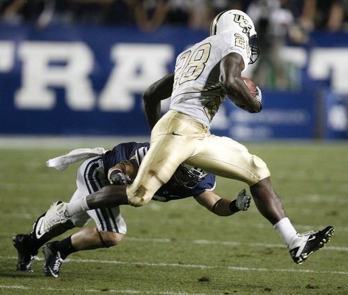 Trent Nelson  |  The Salt Lake Tribune
BYU's Spencer Hadley dives at Central Florida's Latavius Murray. BYU vs. Central Florida, college football at LaVell Edwards Stadium in Provo, Utah, Friday, September 23, 2011.