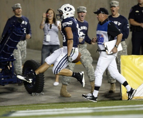Trent Nelson  |  The Salt Lake Tribune
BYU's JJ Di Luigi high-steps into the end zone for a touchdown. BYU vs. Central Florida, college football at LaVell Edwards Stadium in Provo, Utah, Friday, September 23, 2011.