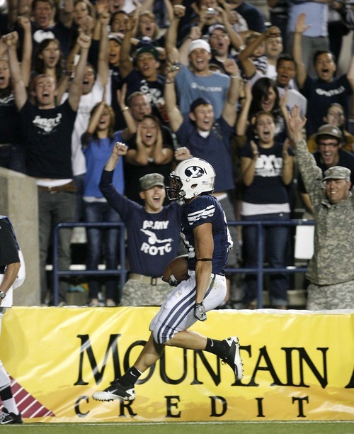 Trent Nelson  |  The Salt Lake Tribune
BYU's JJ Di Luigi high-steps into the end zone for a touchdown. BYU vs. Central Florida, college football at LaVell Edwards Stadium in Provo, Utah, Friday, September 23, 2011.