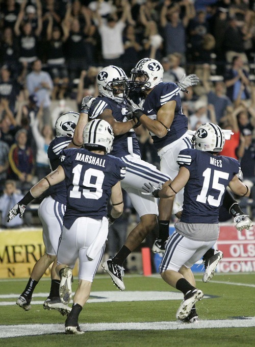 Trent Nelson  |  The Salt Lake Tribune
BYU players celebrate Cody Hoffman's touchdown run on a kick return in the third quarter. BYU vs. Central Florida, college football at LaVell Edwards Stadium in Provo, Utah, Friday, September 23, 2011.