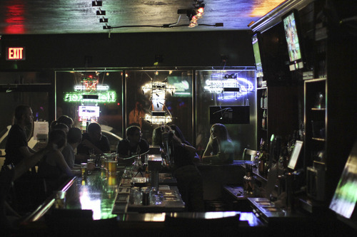 Lennie Mahler  |  The Salt Lake Tribune
Bar-goers drink and chat at the north bar in Sugar House Pub.