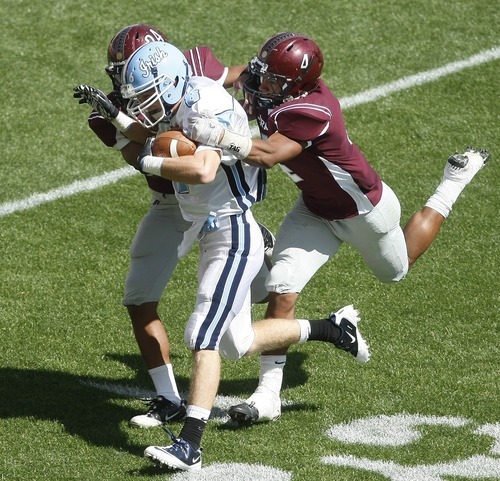 Chris Detrick  |  The Salt Lake Tribune
Jordan's Blake Miller (4) and Jordan's Jerome Bettis Vauituu (24) tackle Notre Dame's Mike Young (6) during the game at Rio Tinto Stadium Saturday September 24, 2011. Jordan won the game 39-0.