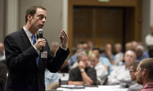 Paul Fraughton  |  The Salt Lake Tribune 
Andrew Gruber, Executive Director of The Wasatch Front Regional Council speaks at the quarterly consortium meeting of Wasatch 2040. Community  leaders, concerned with handling growth along the Wasatch Front, met in the Calvin L. Rampton Salt Palace Convention Center to begin the implementation of the 2040 plan  dealing with transportation, green spaces, living spaces etc. along the Wasatch Front.
  Monday, September 26, 2011