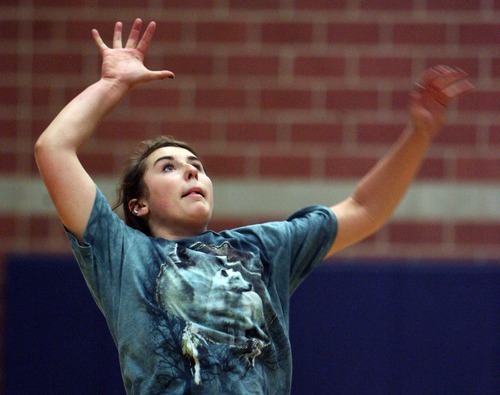 Steve Griffin  |  The Salt Lake Tribune
Waterford's Chandler Rosenberg jumps for a spike during practice.