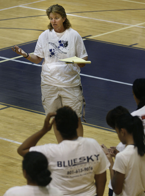 Scott Sommerdorf  |  The Salt Lake Tribune             
Hunter Volleyball coach Pam Olson talks to the team prior to practice about selling raffle tickets and other duties on Monday. Former Hunter volleyball player Janelle Tongaonevai, wife of University of Utah defensive lineman Ron Tongaonevai, passed away following a Sept. 1 car accident that also involved her sister Jazmyn Davidson. The Hunter volleyball team is organizing a fundraiser for the Davidson family.