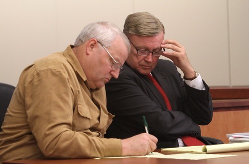 Rick Egan  | The Salt Lake Tribune 

Chuck Cox, left, makes notes for his attorney, Steve Downing (right), during a custody hearing at the Pierce County Superior Courthouse in Tacoma, Wash., on Tuesday.