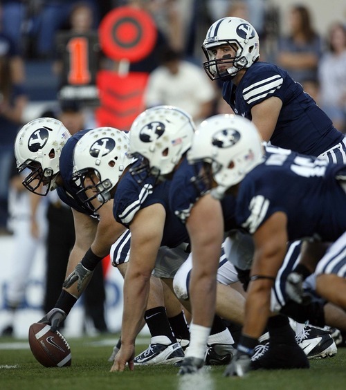 Trent Nelson  |  The Salt Lake Tribune
BYU quarterback Jake Heaps at the line of scrimmage. BYU vs. Central Florida, college football at LaVell Edwards Stadium in Provo, Utah, Friday, September 23, 2011.