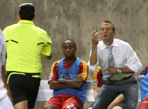 Real Salt Lake head coach Jason Kreis helps the referee count how many times Espindola has been knocked down without a call in the first half against the Chicago Fire in Rio Tinto Stadium.
Stephen Holt/ Special to the Tribune