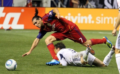 Real Salt Lake forward Fabian Espindola is tripped up by Chicago Fire defender Dan Gargan during RSL's 0-3 home loss in Rio Tinto Stadium.
Stephen Holt/ Special to the Tribune