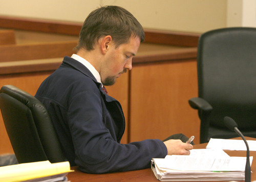 Rick Egan I The Salt Lake Tribune
Josh Powell sits alone at the table in the courtroom as he signs an order after the proceedings in the shelter care hearing at the Pierce County Superior Court house in Tacoma, Wash., on Wednesday.