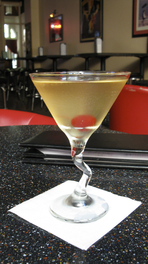 Lesli J. Neilson  | The Salt Lake Tribune 
The Crisp Pear ($8) at Kristauf's Martini Bar is made with Grey Goose La Poire, peach schnapps, pineapple juice, champagne and a cherry garnish.