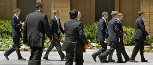 Steve Griffin | The Salt Lake Tribune New missionaries walk on the campus of the Missionary Training Center in Provo in June 2007. There are more than a dozen other such training centers in the world.