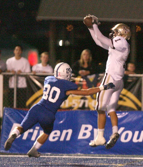Paul Fraughton  |  The Salt Lake Tribune 
Lone Peak's Micah Hannemann  goes up against defender  Koa Wilson and catches the ball in the end zone for a Lone Peak touchdown. The Bingham High Miners played Lone Peak High School at Bingham
  Thursday, September 29, 2011