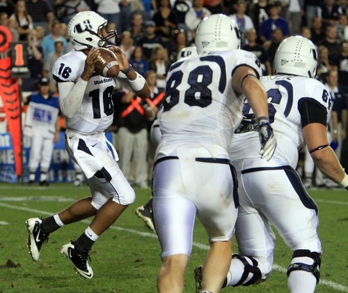 Rick Egan  | The Salt Lake Tribune 

 Utah State Aggies quarterback Chuckie Keeton (16) prepares to throw long on the last play of the game, with the Aggies down by 3 points, BYU vs. Utah State, in Provo, Friday, September 30, 2011.