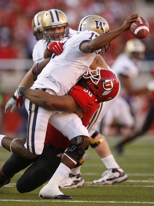 Trent Nelson  |  The Salt Lake Tribune
Utah's Derrick Shelby brings down Washington quarterback Keith Price during the second quarter. Utah vs. Washington, college football at Rice-Eccles Stadium in Salt Lake City, Utah, Saturday, October 1, 2011.