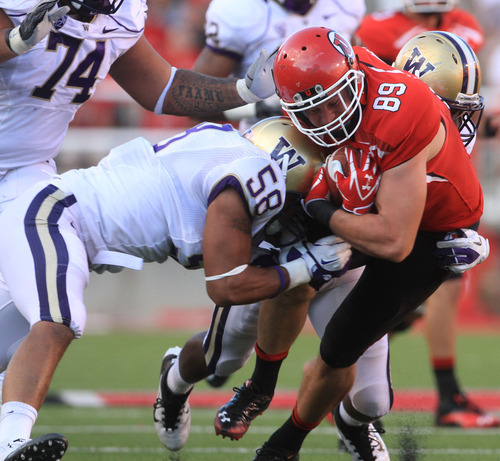 Rick Egan  | The Salt Lake Tribune 

Washington Huskies linebacker Jamaal Kearse (58) brings down Utah Utes tight end Dallin Rogers (89) in Pac-12 action, Utah vs. University of Washington, at Rice-Eccles stadium, Saturday, October 1, 2011.