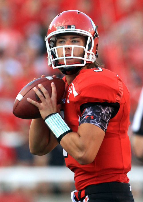 Rick Egan  | The Salt Lake Tribune 

 Utah Utes quarterback Jordan Wynn (3) looks down field, in Pac-12 action, Utah vs. University of Washington, at Rice-Eccles stadium, Saturday, October 1, 2011.