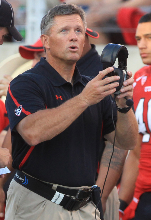 Rick Egan  | The Salt Lake Tribune 

Ute's head coach Kyle Whittingham checks out the clock, in Pac-12 action, Utah vs. University of Washington, at Rice-Eccles stadium, Saturday, October 1, 2011.