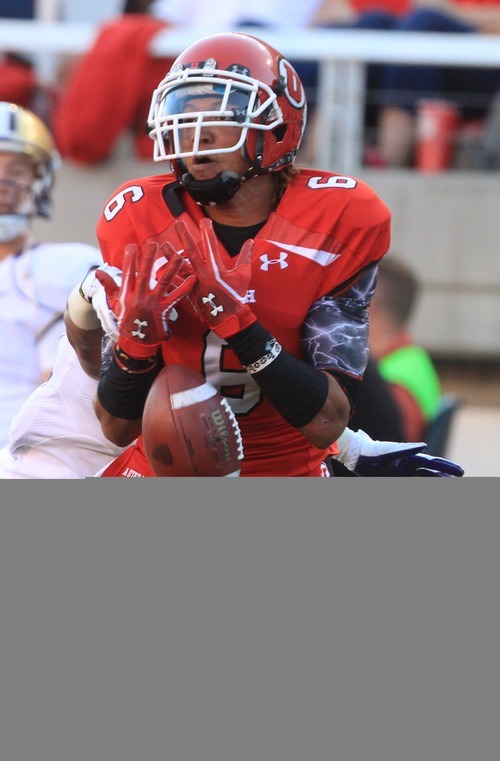 Rick Egan  | The Salt Lake Tribune 

Utah Ute's wide receiver Dres Anderson (6) cant quite hold on to the ball, as the pass drops between his arms, in Pac-12 action, Utah vs. University of Washington, at Rice-Eccles stadium, Saturday, October 1, 2011.