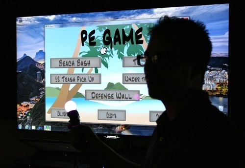 Leah Hogsten | The Salt Lake Tribune
Game producer Kurt Coppersmith is silhouetted by the PE  or 