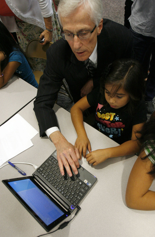 Francisco Kjolseth  |  The Salt Lake Tribune
Lt. Gov. Greg Bell surfs the Internet with Rose Park Elementary school student Stephanie Cruz, 8, after a news conference at the school on Monday, Oct. 3, 2011, to introduce 'Internet Essentials,' a program to help connect low-income families to the Internet and sponsored by Comcast Cable Corp.