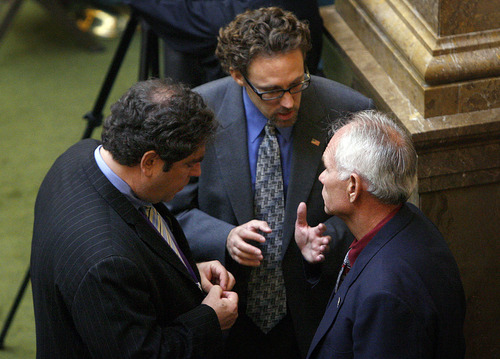 Scott Sommerdorf  |  The Salt Lake Tribune             
Left to right, Democratic Reps. Brian King and David Litvack, both of Salt Lake City, huddle with Neil Hendrickson, D-West Valley City, on the House floor Monday.
