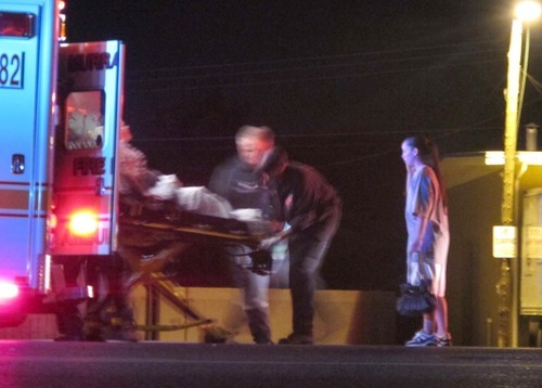 Keith Johnson | The Salt Lake Tribune

A shooting victim is loaded into an ambulance at the scene of a shooting at the Arbat Reception Center in South Salt Lake, Utah October 01, 2011.