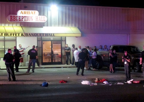 Keith Johnson | The Salt Lake Tribune

Law enforcement officials investigate a shooting at the Arbat Reception Center in South Salt Lake, Utah October 01, 2011.