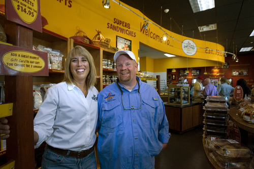 Paul Fraughton  |  The Salt Lake Tribune 
Jo and Rand Kunz at their Great Harvest Bread Co. in Taylorsville. Their store makes more than $1 million in sales annually.